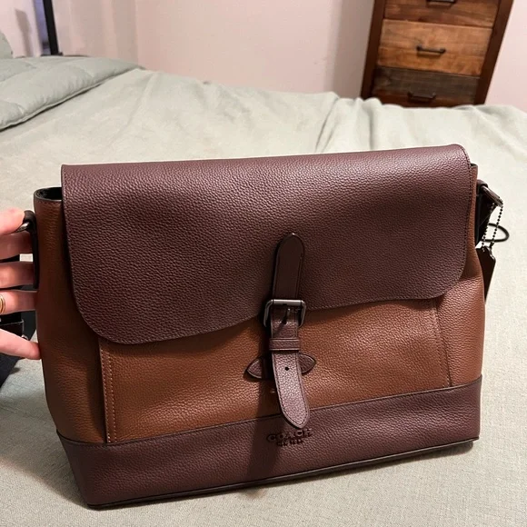 Mens Coach laptop bag. NEVER used. No tag, it was a gift. Perfect condition.